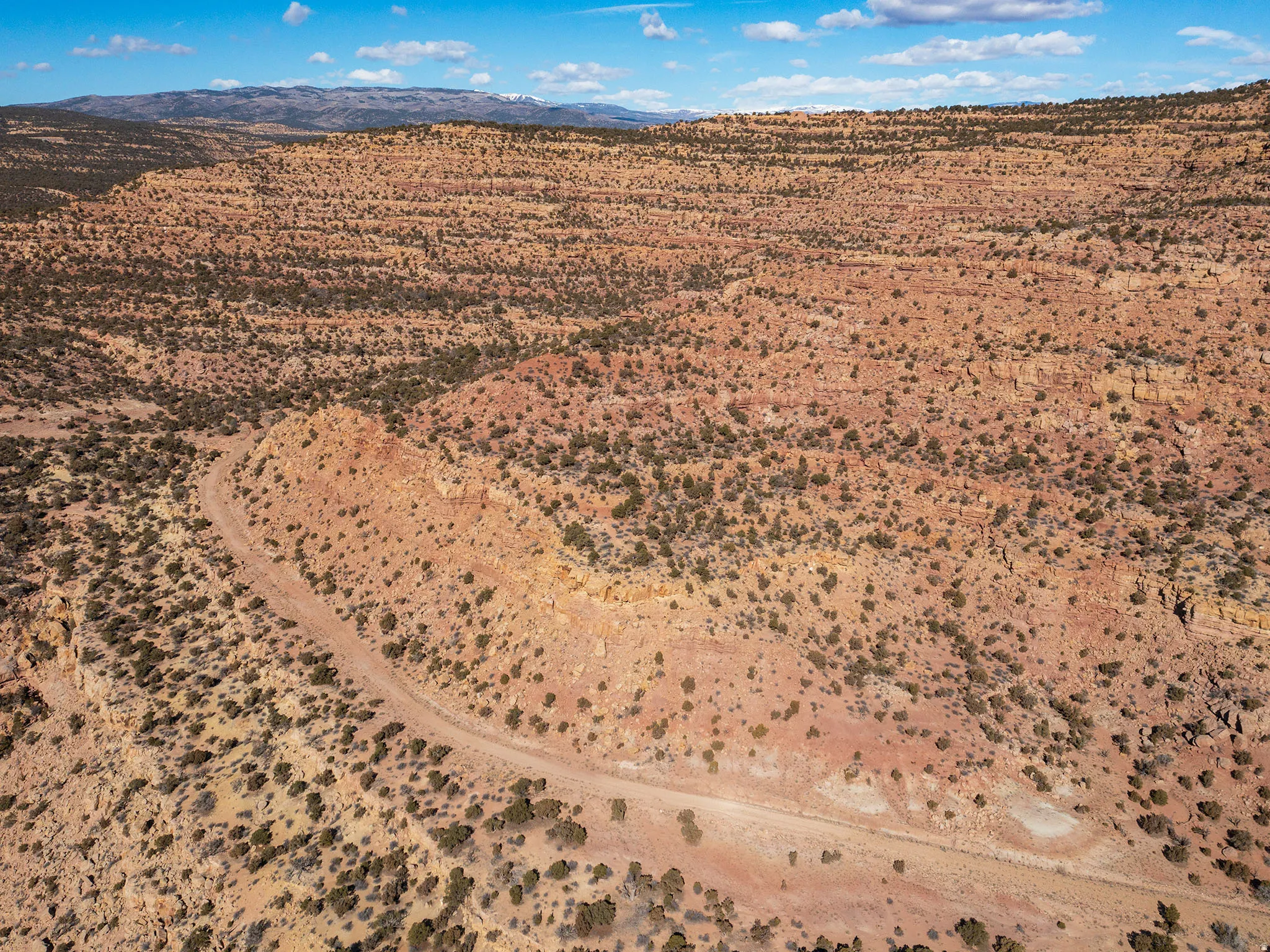 View of rural area with a desert landscape and mountains