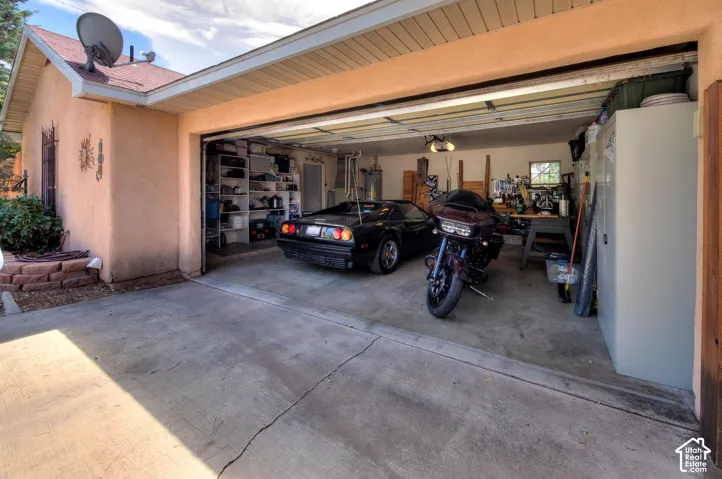 Oversized double car Garage with additional parking for 5 vehicles to the left of the Garage. RV parking as well.