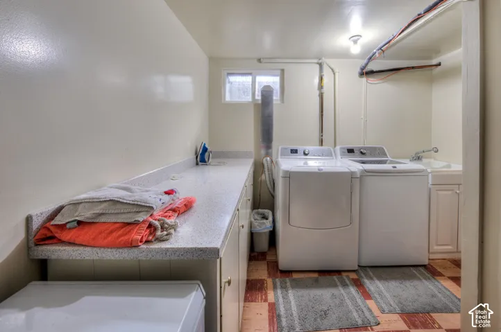 Laundry room with washer/dryer, folding counter & cabinet space