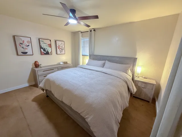 Bedroom featuring carpet floors and ceiling fan