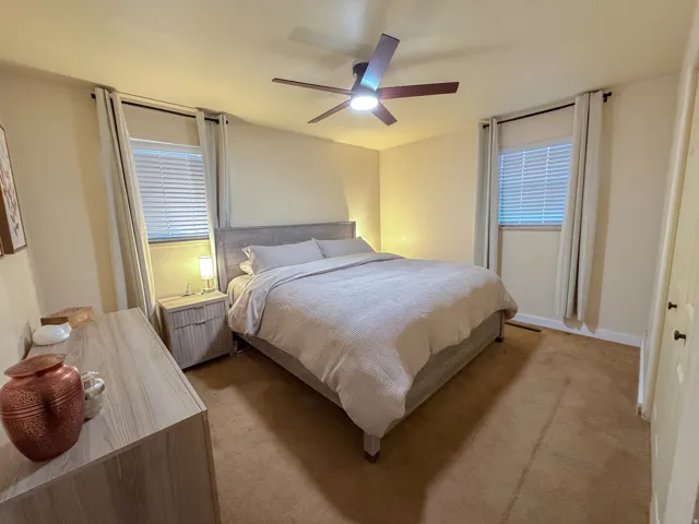 Bedroom with carpet and a ceiling fan