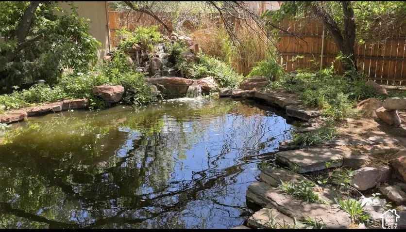 Upper pond boast a waterfall as the water recirculates up from the lower pond.