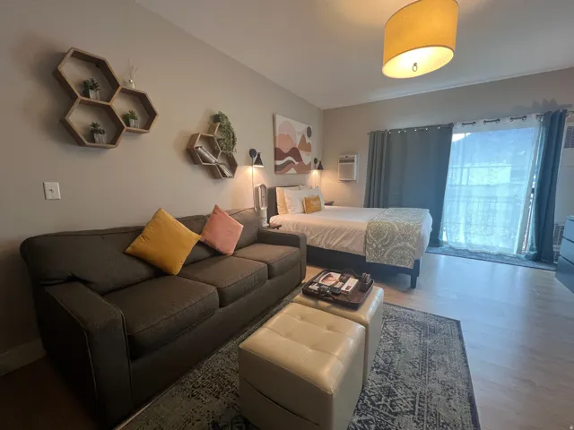 One queen size bed and one twin size pull out couch