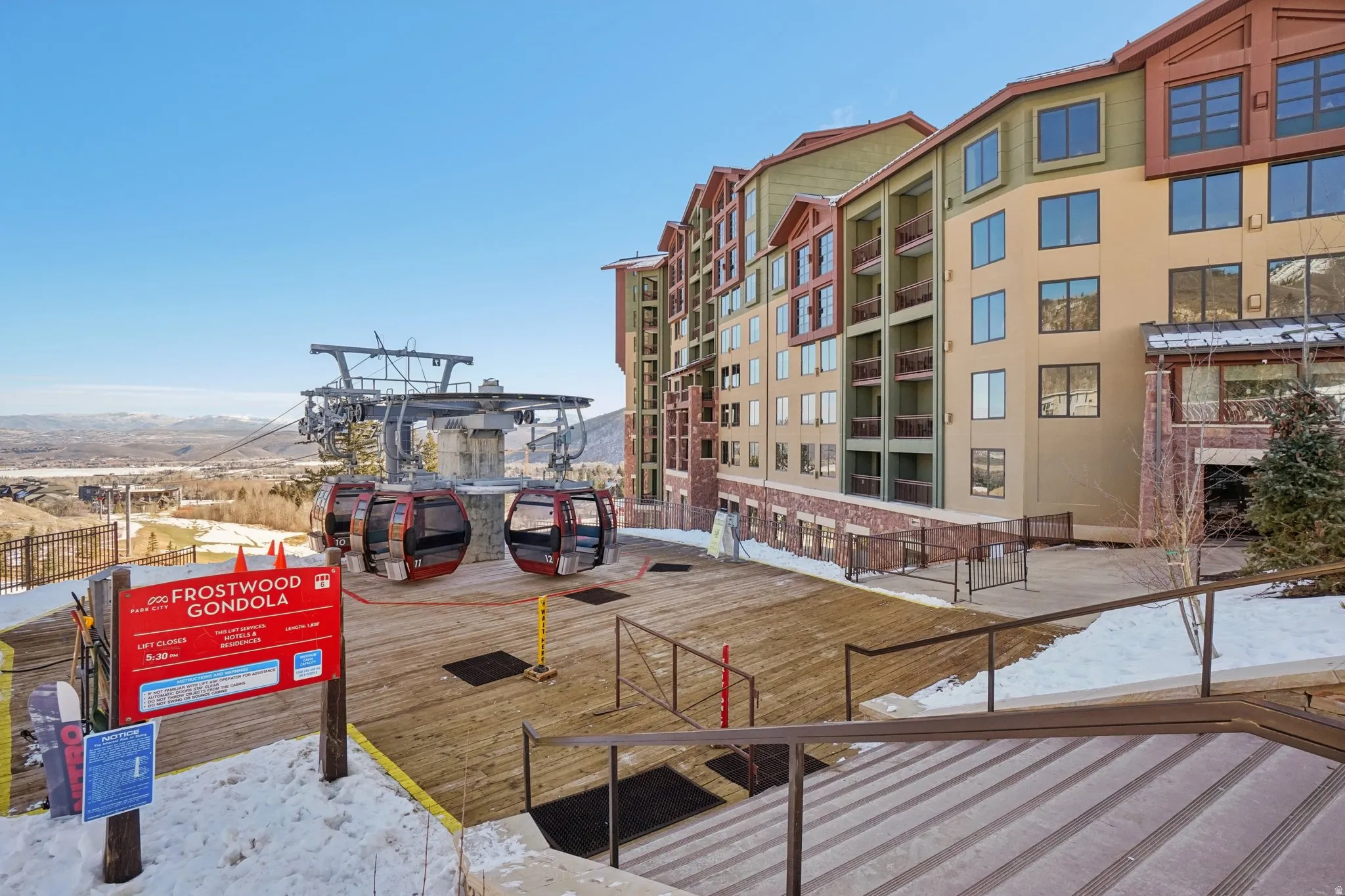 View of community featuring a deck with mountain view