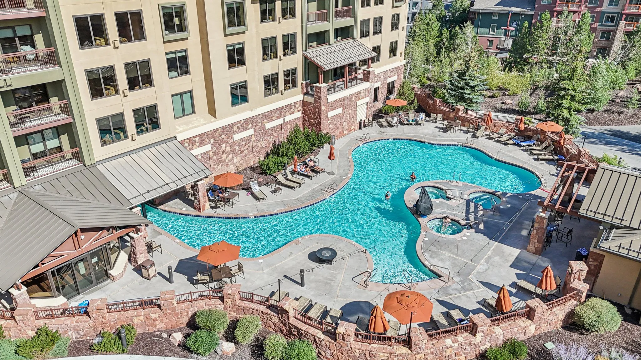 Community pool with a patio
