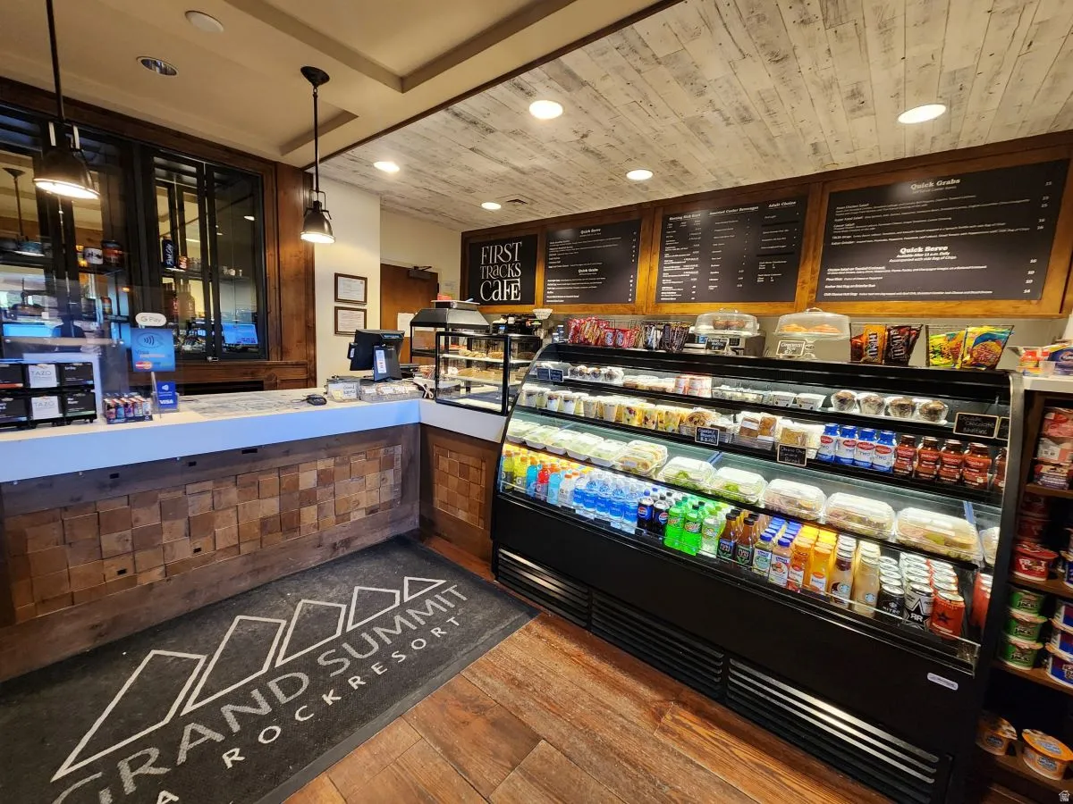 View of home's community featuring recessed lighting, a community bar, and wood ceiling