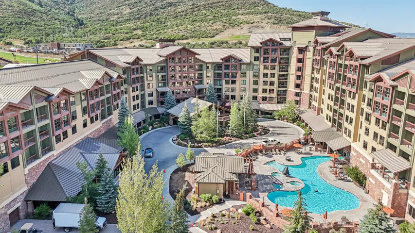 Bird's eye view of a mountainous background and a pool