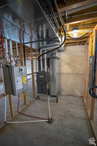 Utilities featuring water heater and heating unit