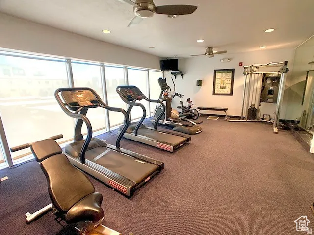 Workout area featuring recessed lighting and a ceiling fan