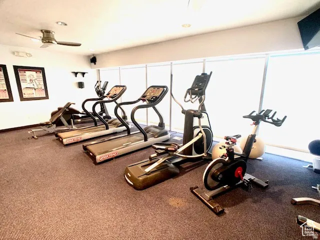 Gym featuring a ceiling fan