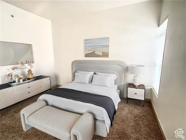 Carpeted bedroom with baseboards