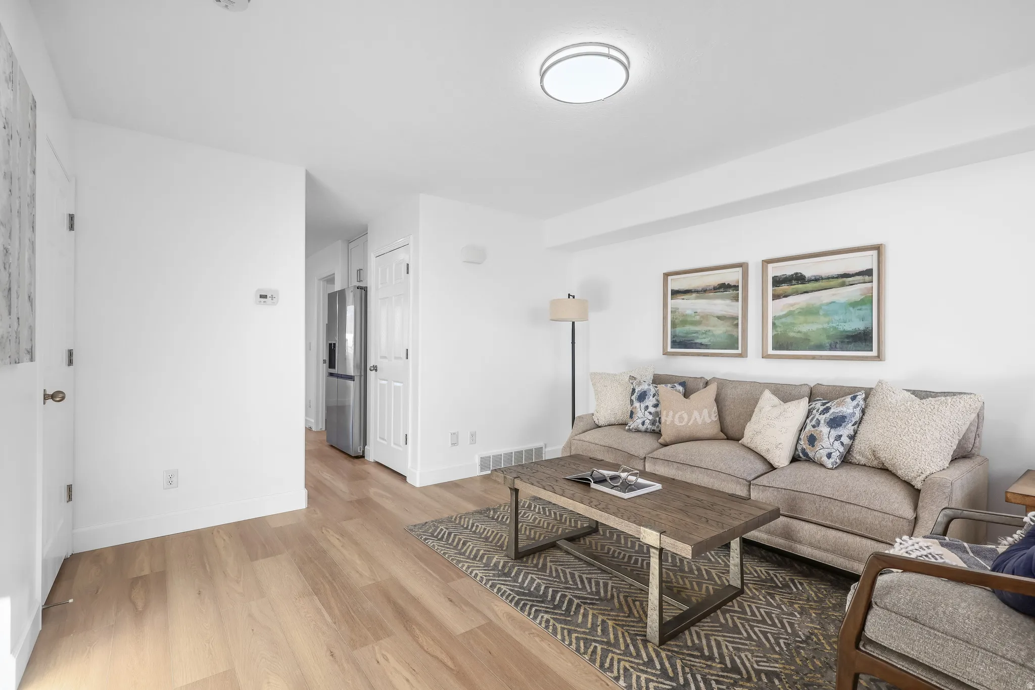 Living room featuring NEW LPV Luxury Vinyl flooring, and new paint