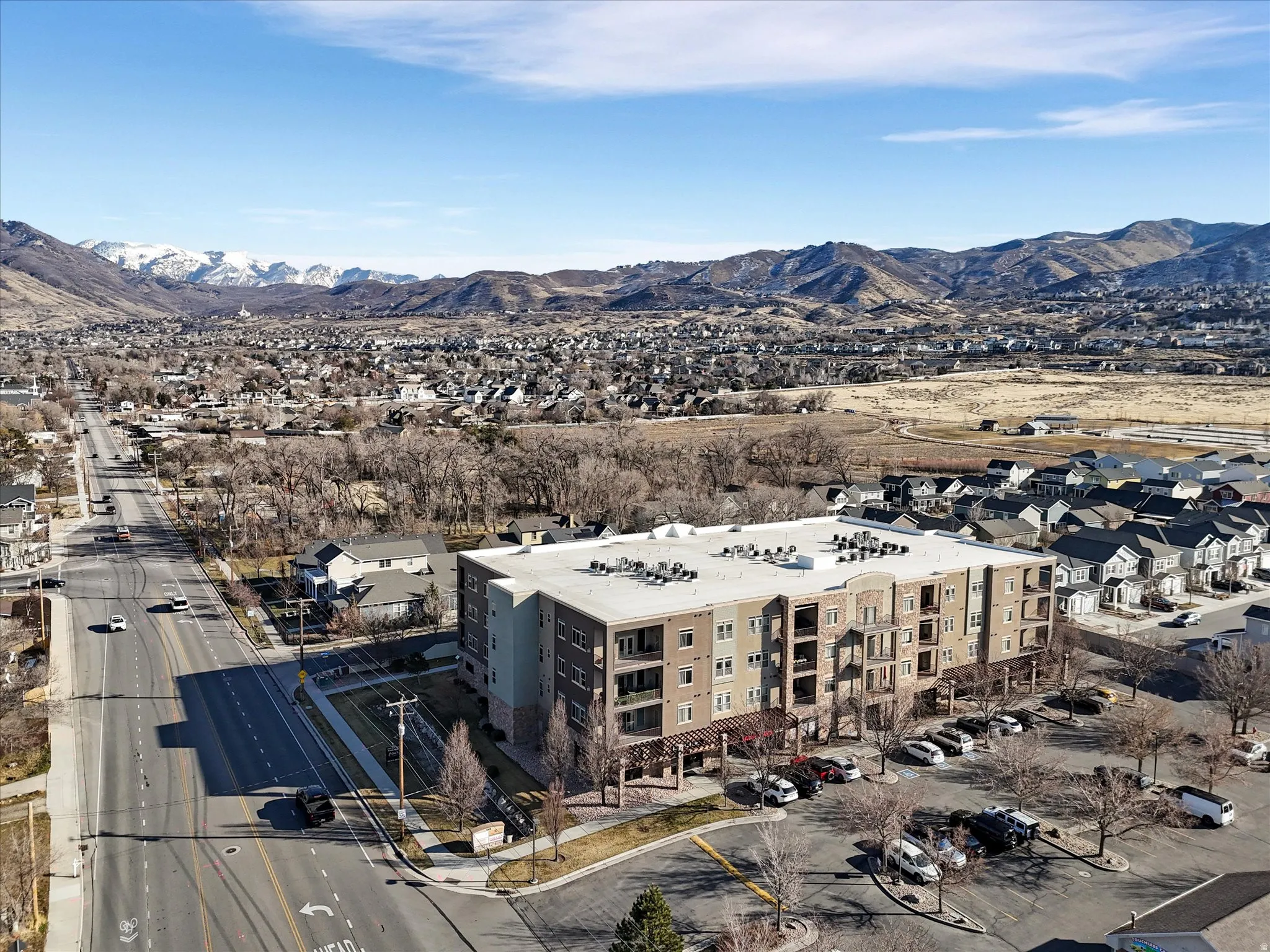 Bird's eye view of a mountainous background and apartment complex