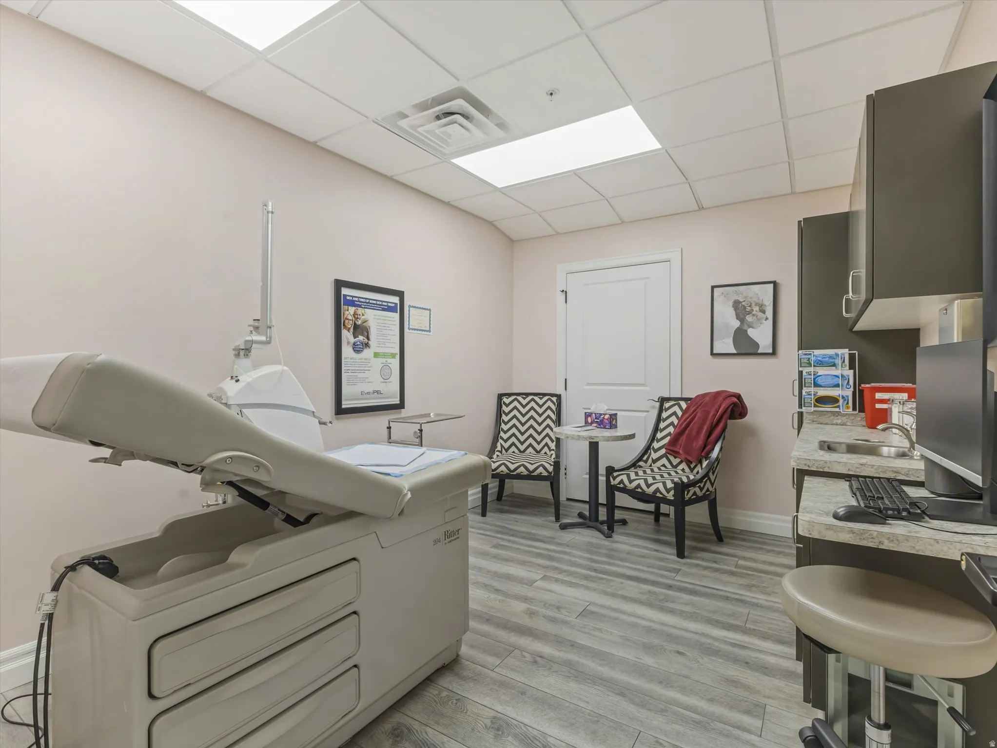 Misc room with a drop ceiling and washer / clothes dryer