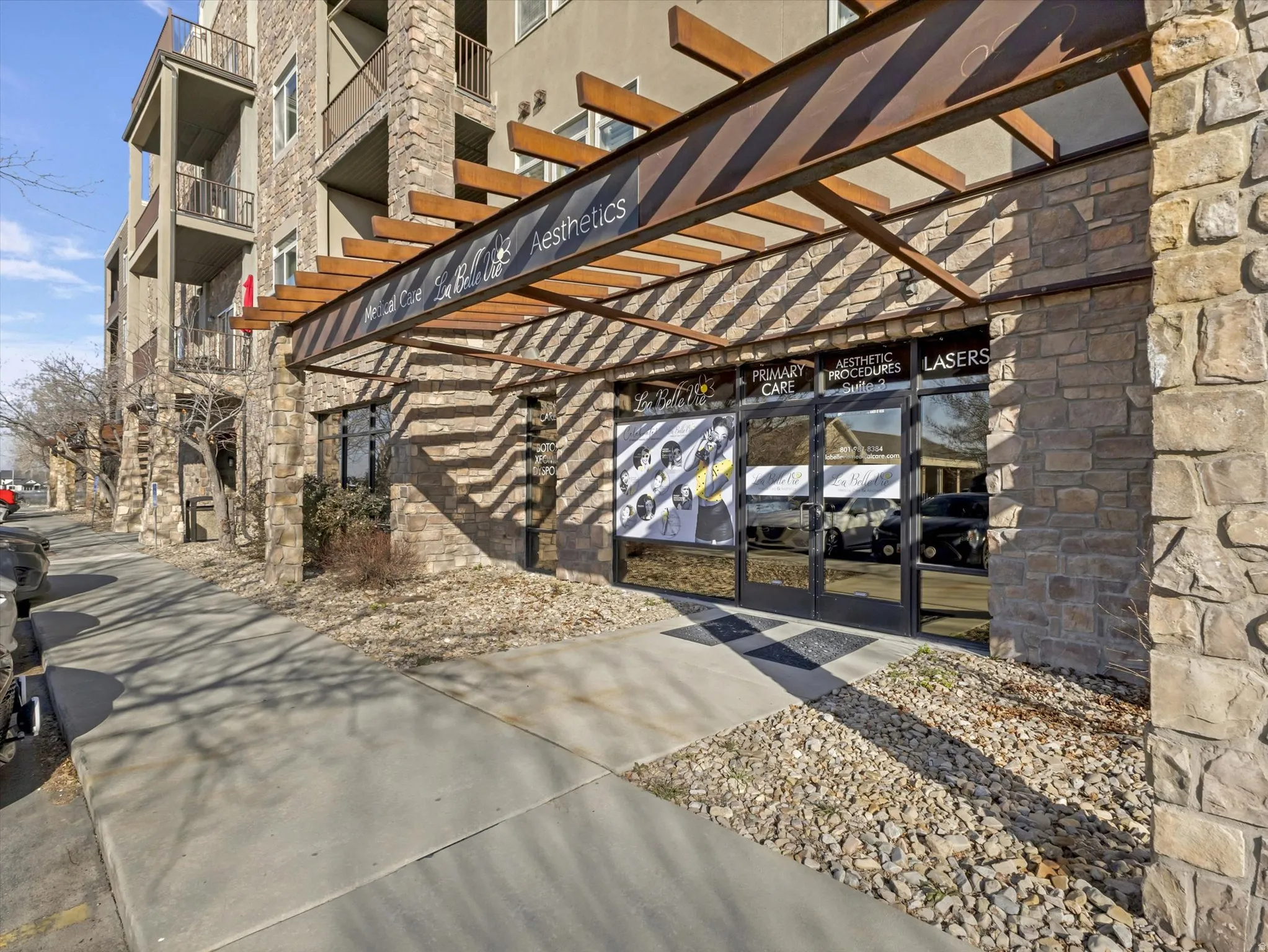 Entrance to property with french doors and stone siding