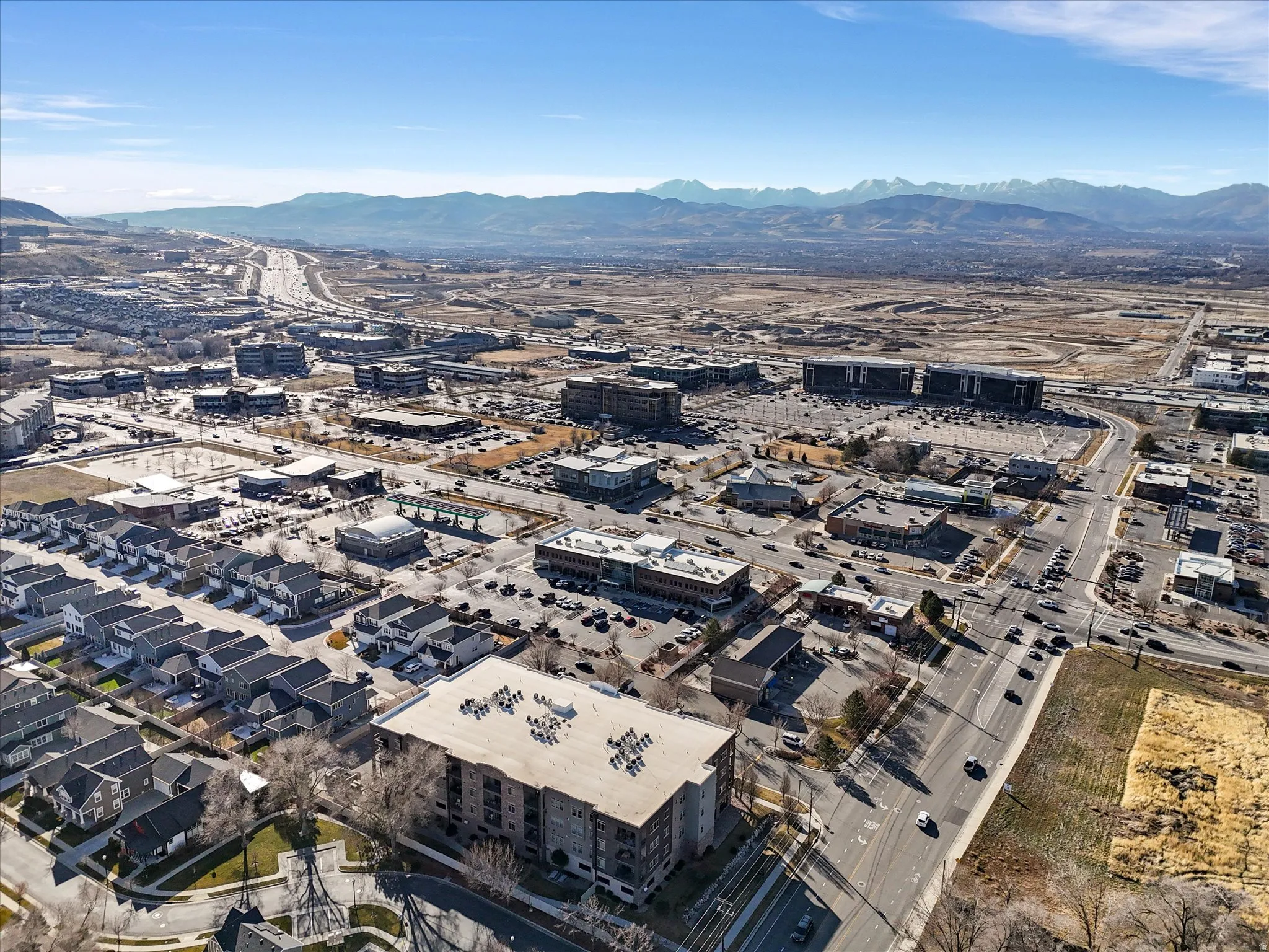 Aerial view of property's location with a mountainous background