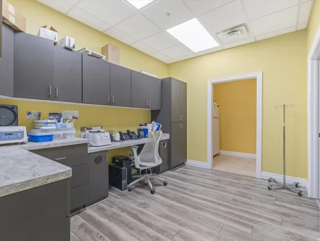 Office featuring a paneled ceiling and built in desk