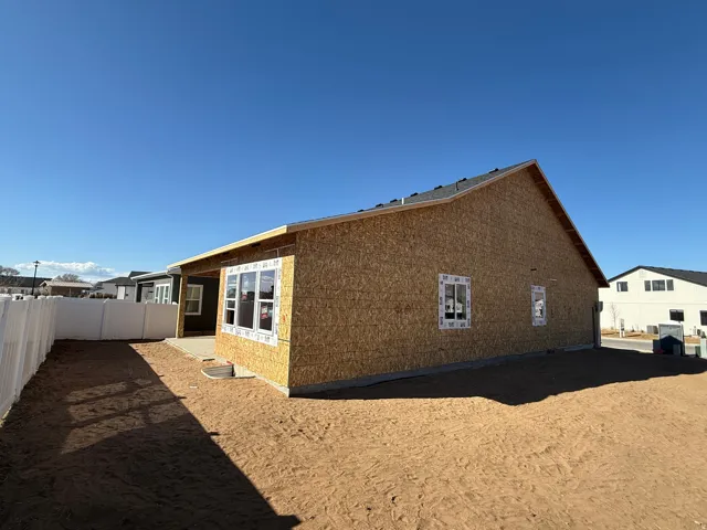 View of side of property with a fenced backyard