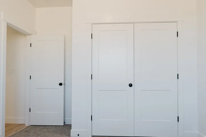 Unfurnished bedroom with a closet and carpet flooring