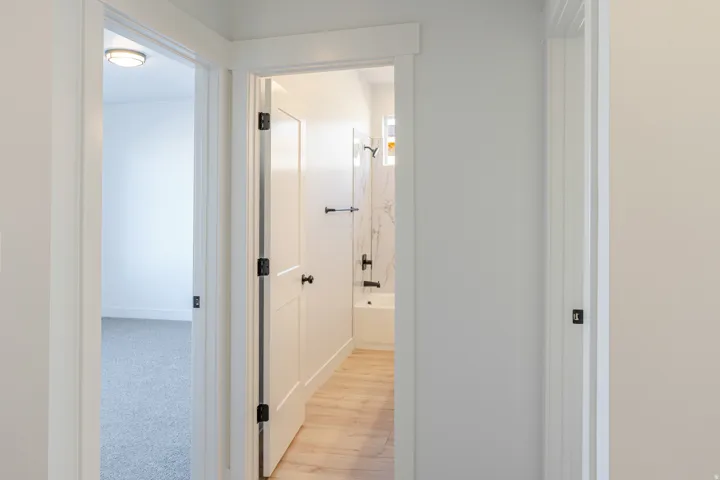 Hall featuring baseboards and light wood finished floors
