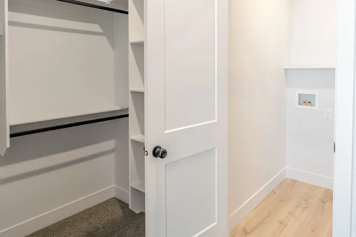 Walk in closet featuring light wood-style floors