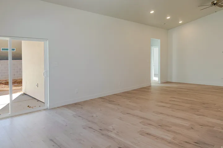 Spare room featuring light wood-style floors, recessed lighting, and a ceiling fan
