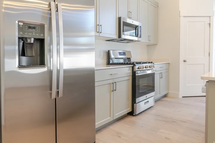 Kitchen featuring stainless steel appliances and light wood-style flooring