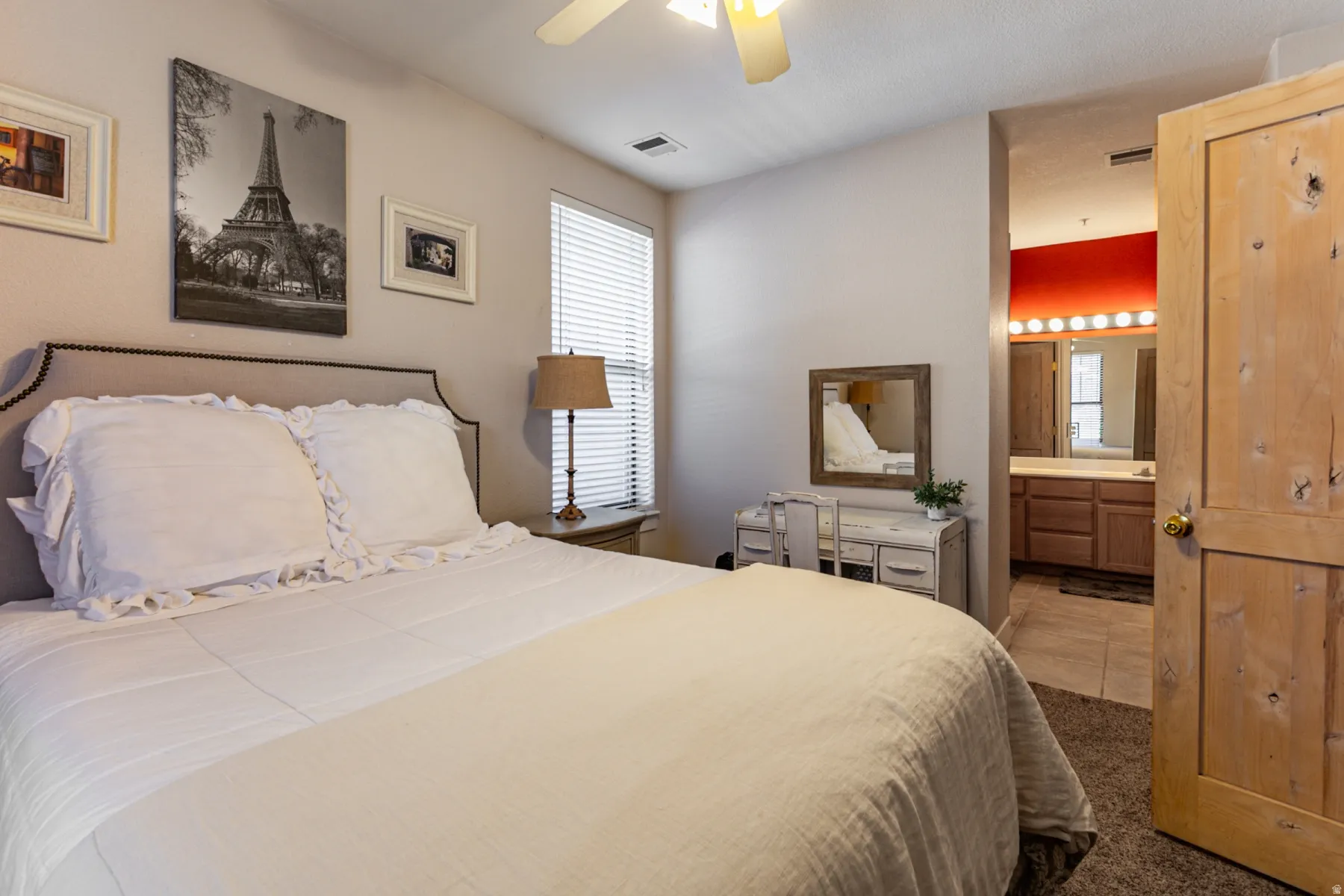 Bedroom with a ceiling fan and carpet