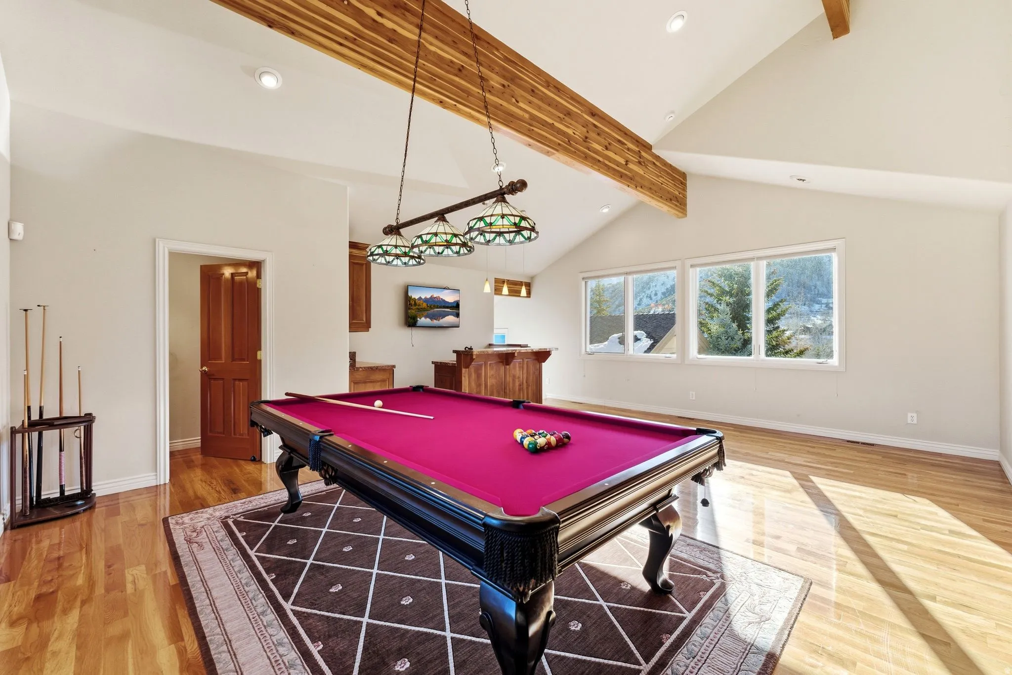 Rec room featuring billiards, recessed lighting, light wood-style floors, lofted ceiling, and shuffleboard