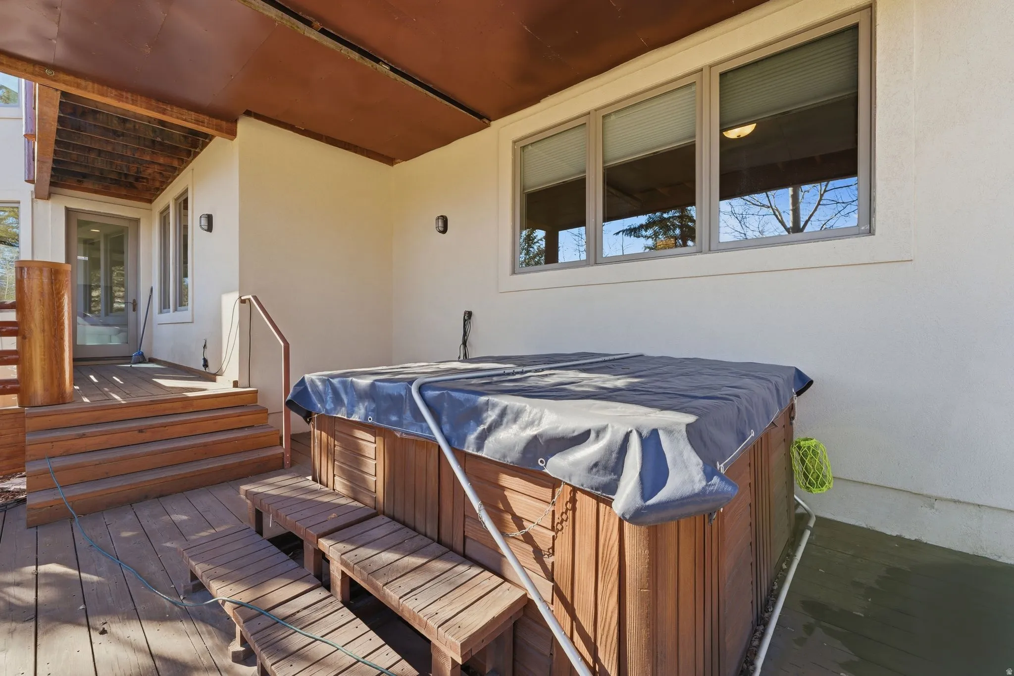 Wooden deck with a hot tub