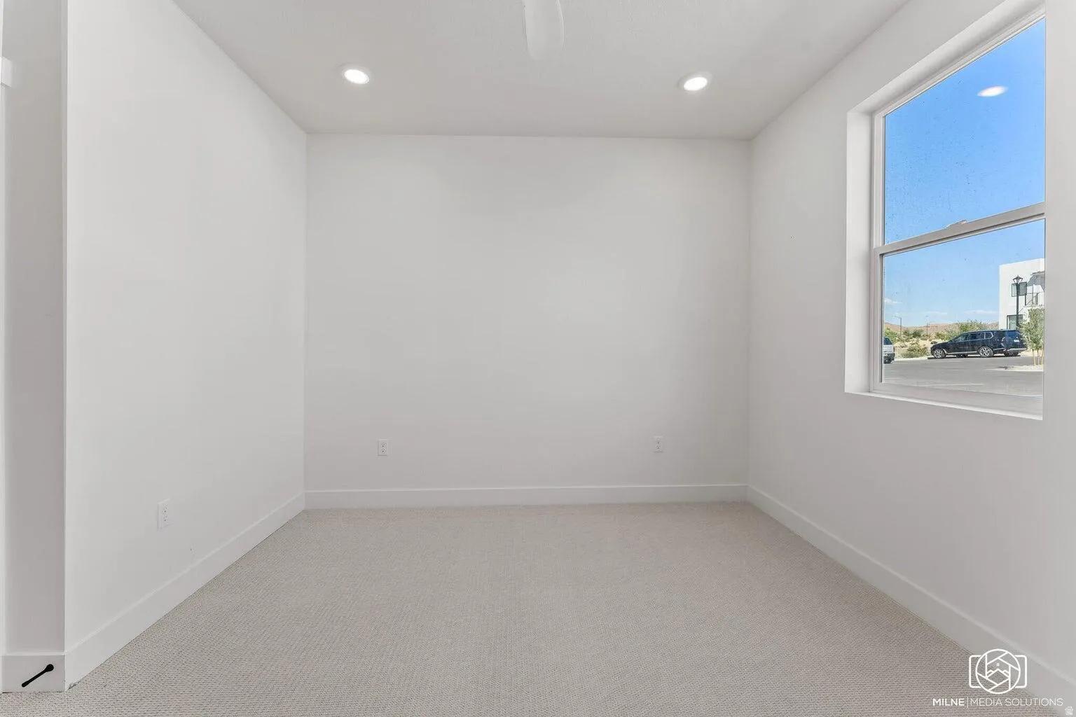 Unfurnished room featuring light carpet and recessed lighting