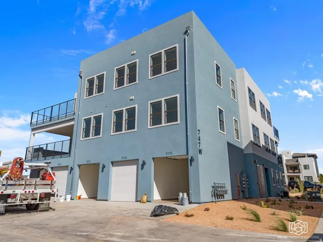 View of building exterior featuring an attached garage