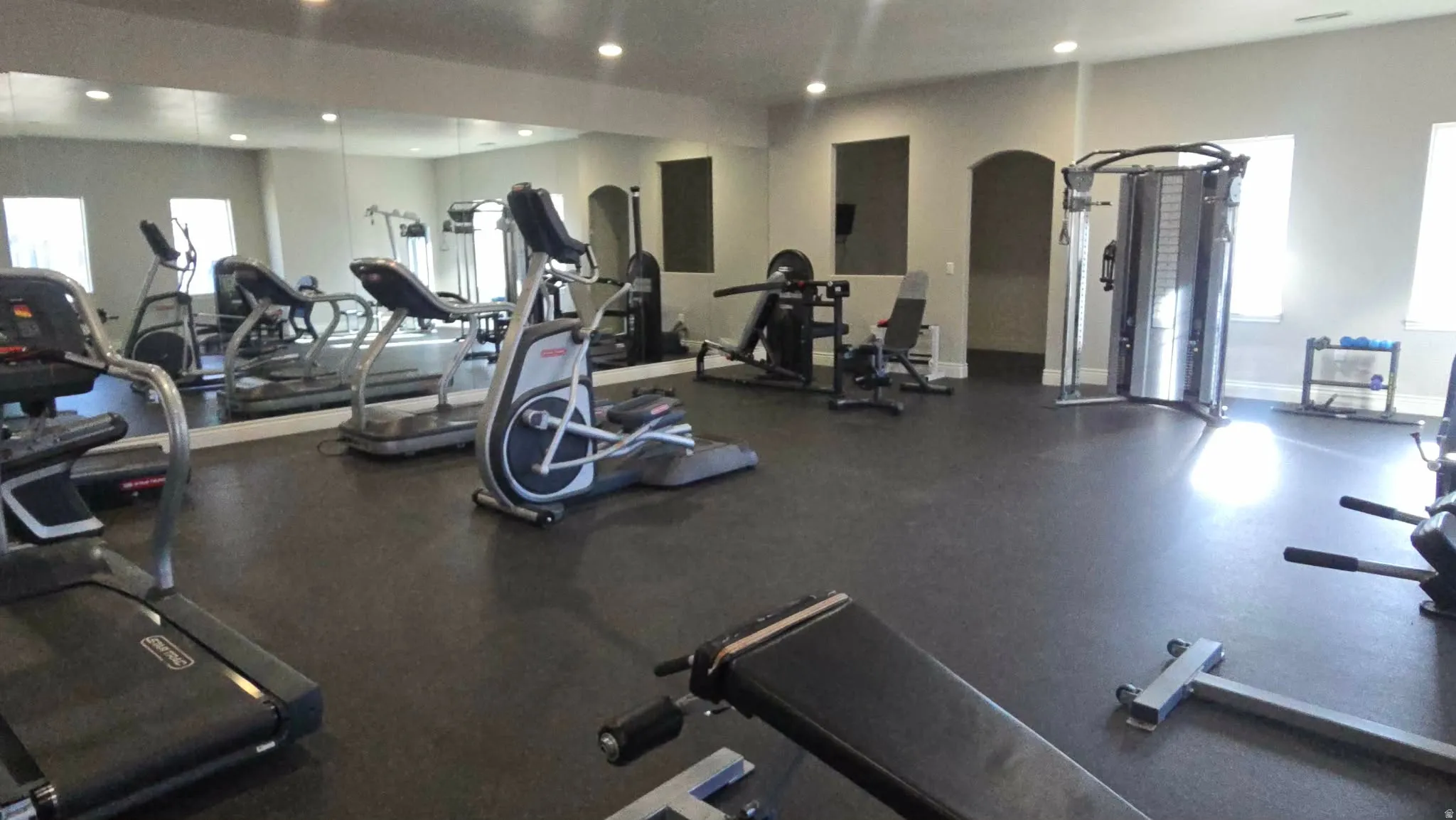 Exercise room featuring recessed lighting