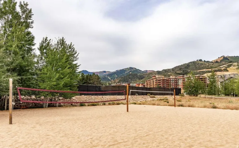 View of property's community featuring volleyball court and a mountain view
