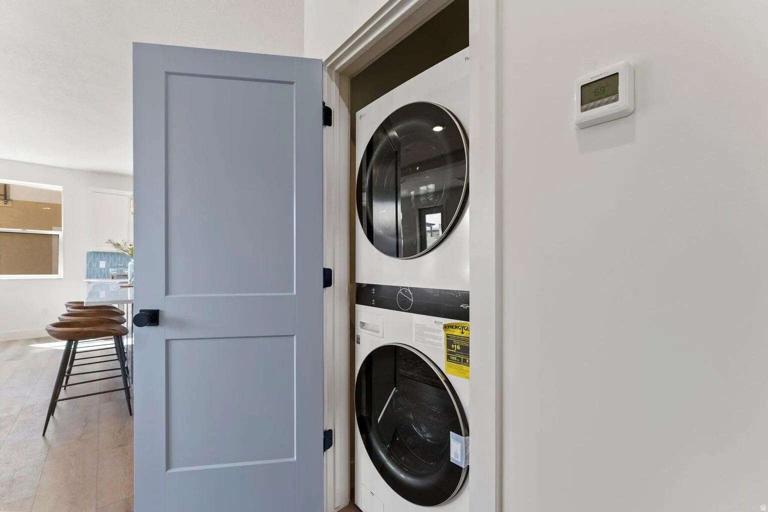 Laundry area with stacked washing machine and dryer