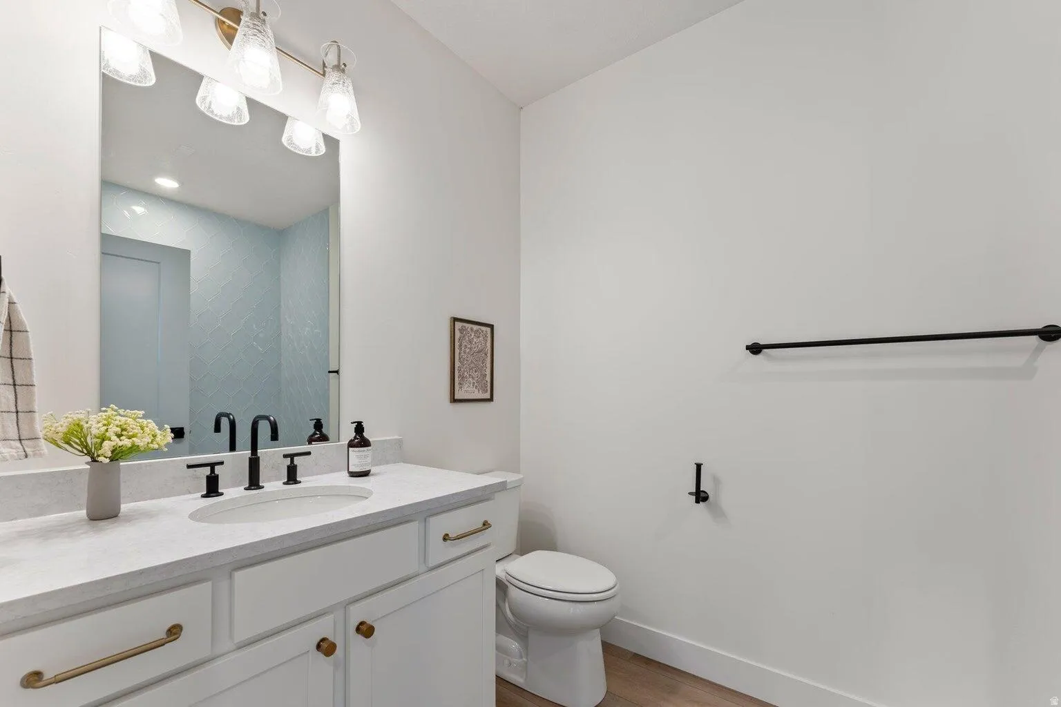 Bathroom featuring vanity and light wood-type flooring