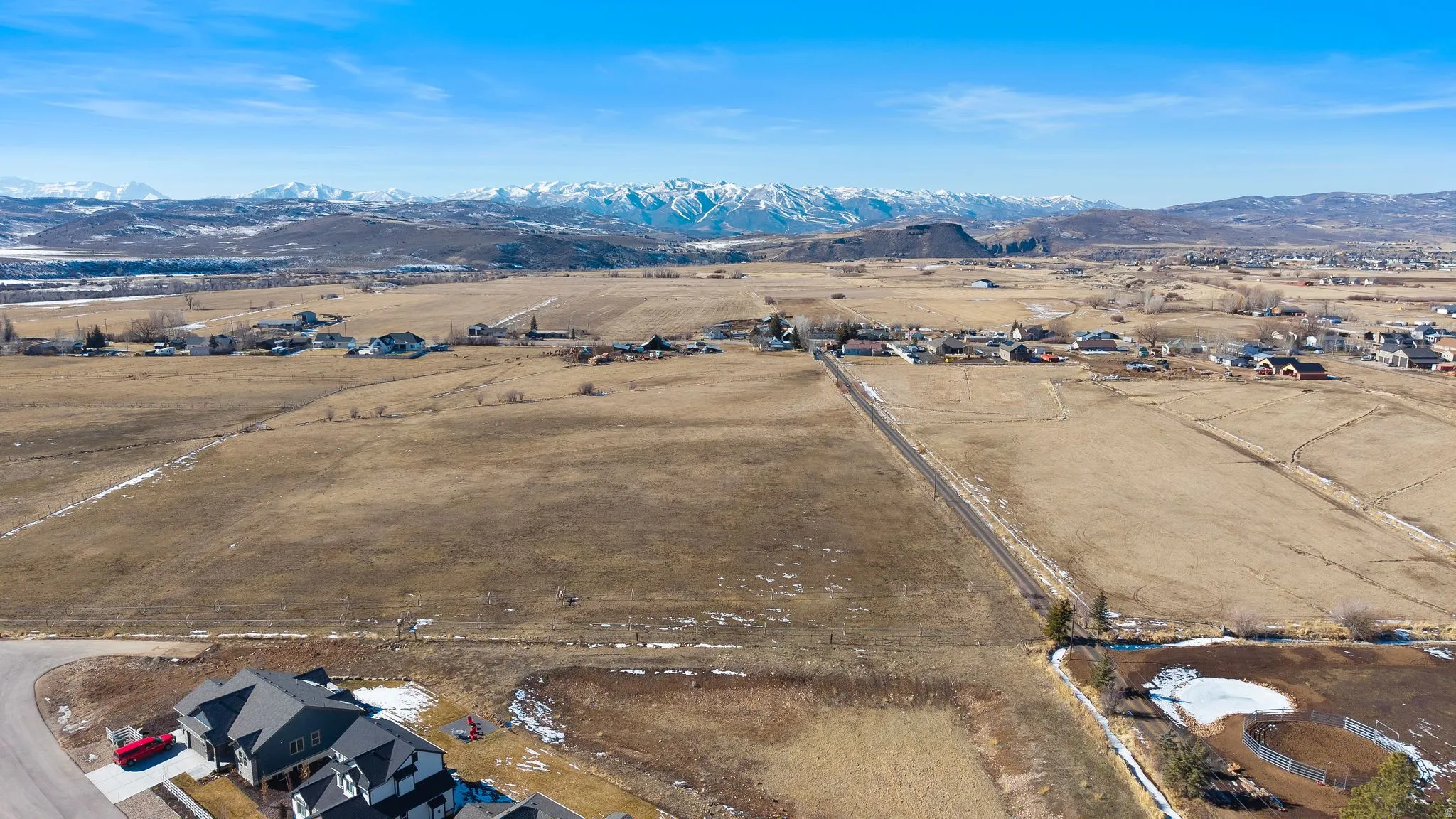 Aerial view of sparsely populated area with a mountain backdrop