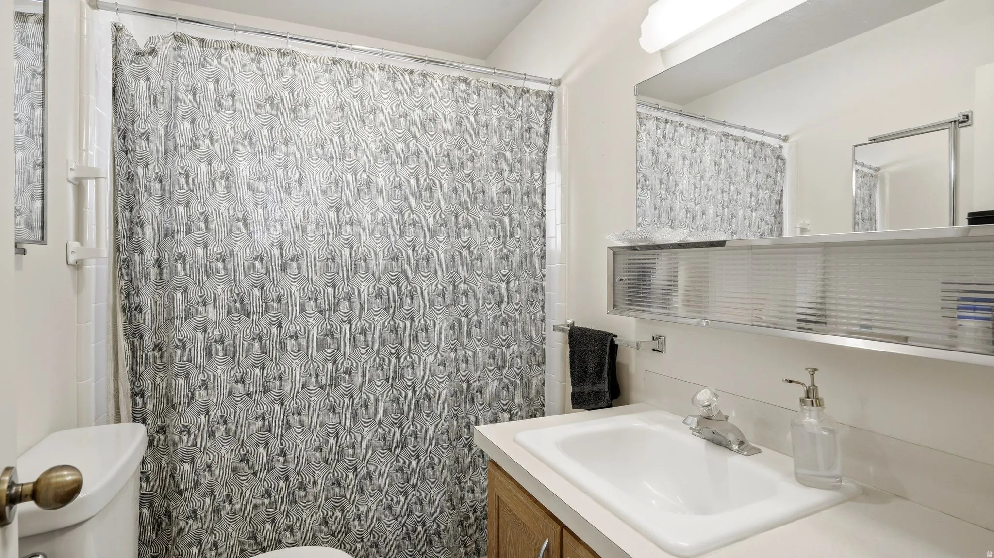 Full bath featuring a shower with curtain and vanity