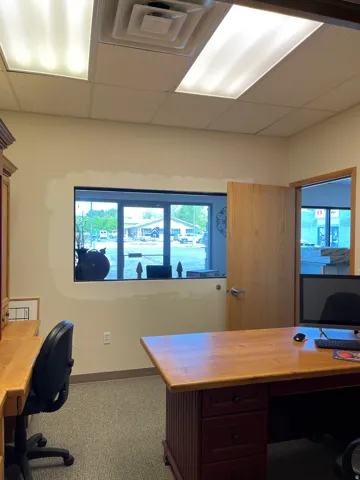 Office space featuring a paneled ceiling and built in study area