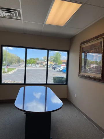 Unfurnished office featuring a drop ceiling