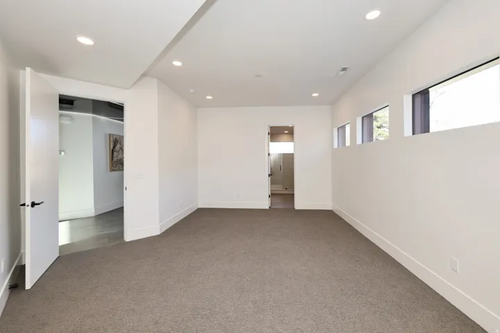 Unfurnished room with carpet and recessed lighting