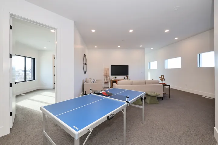 Playroom with carpet floors and recessed lighting