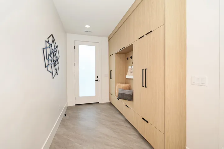 Mudroom with light wood-style flooring and recessed lighting