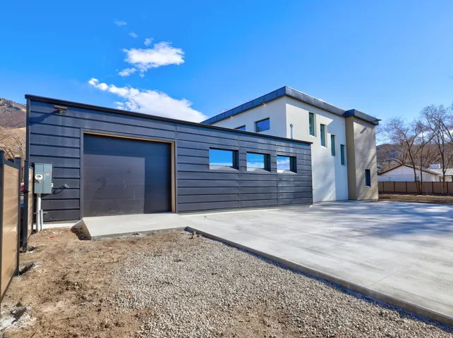 View of side of property with driveway