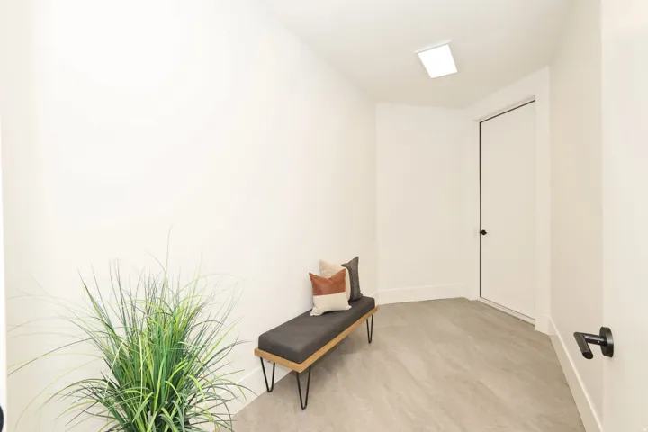Living area featuring baseboards and light wood finished floors