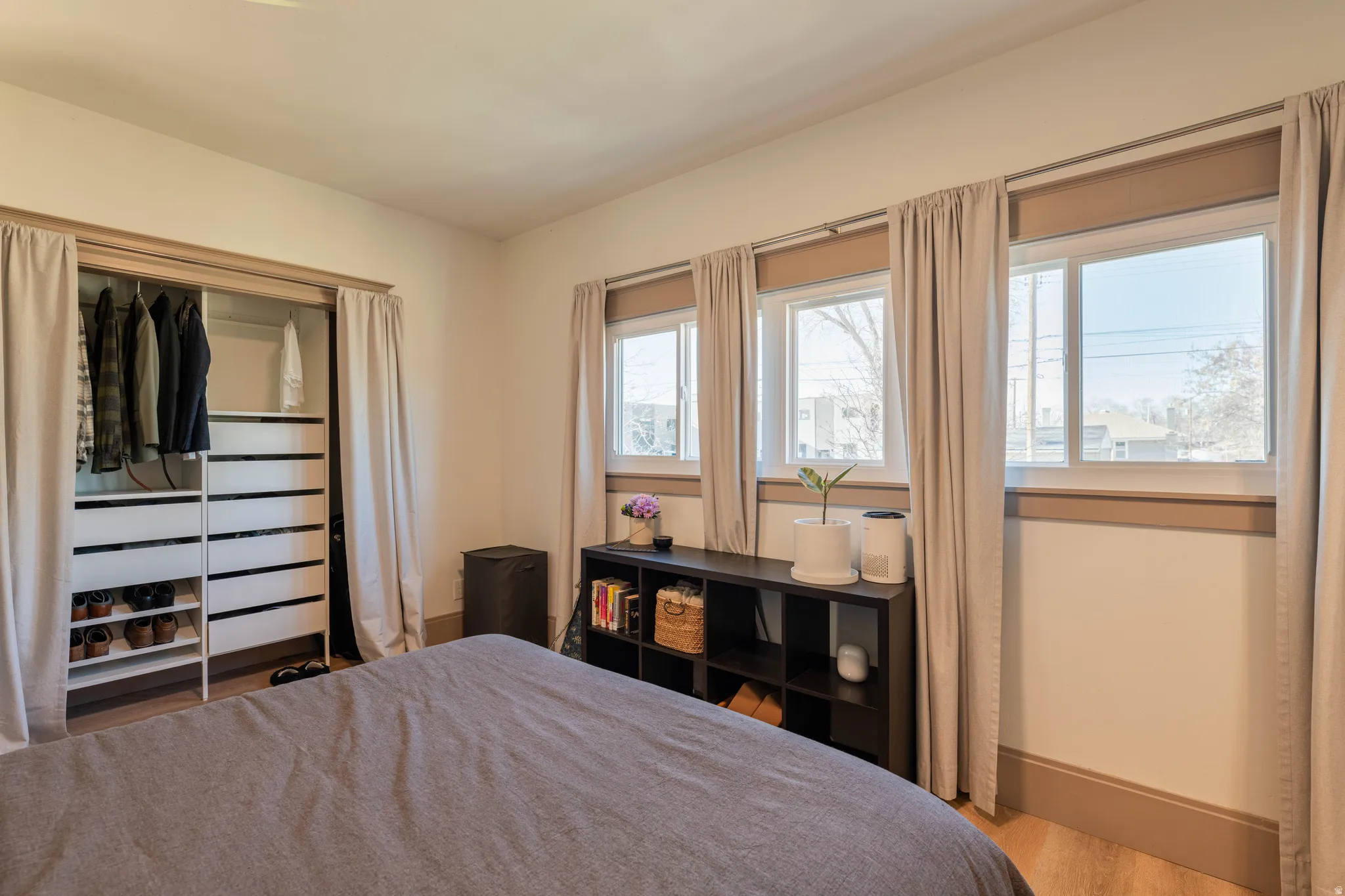 Bedroom featuring baseboards and light wood finished floors