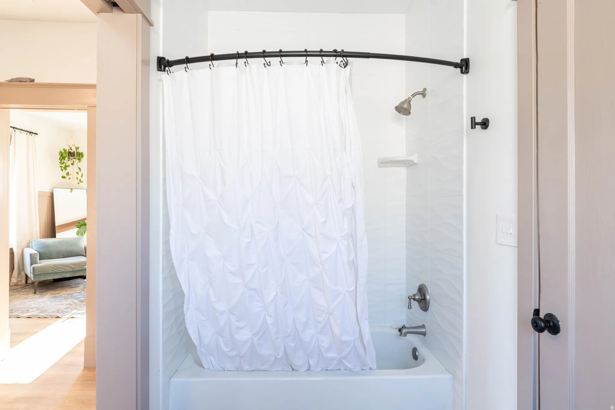 Full bathroom featuring shower / bath combo with shower curtain and connected bathroom