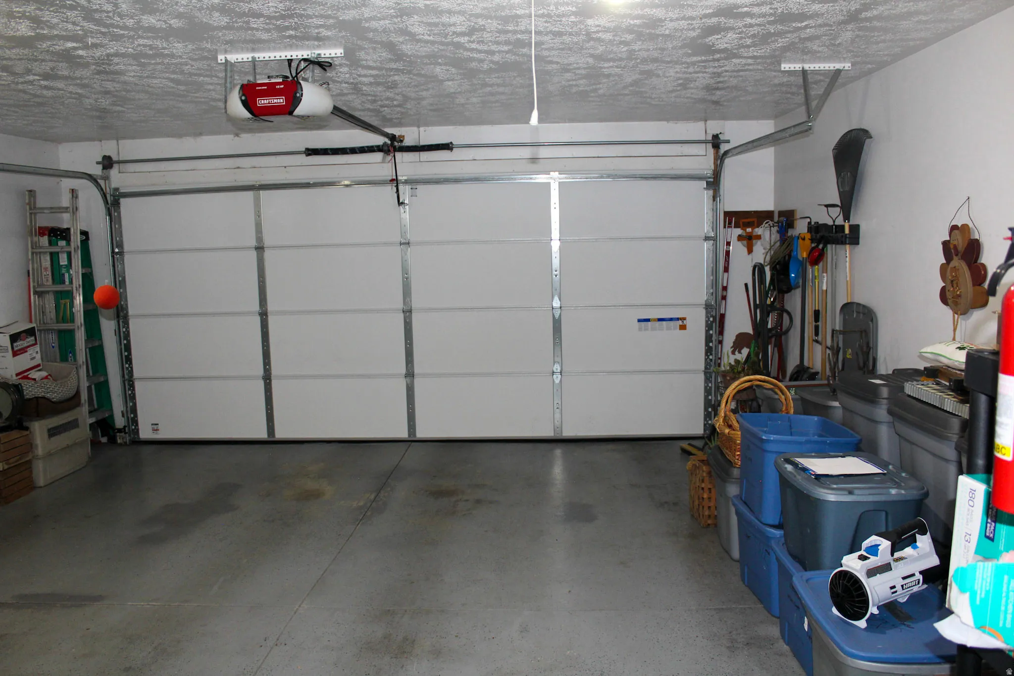 Garage featuring a garage door opener