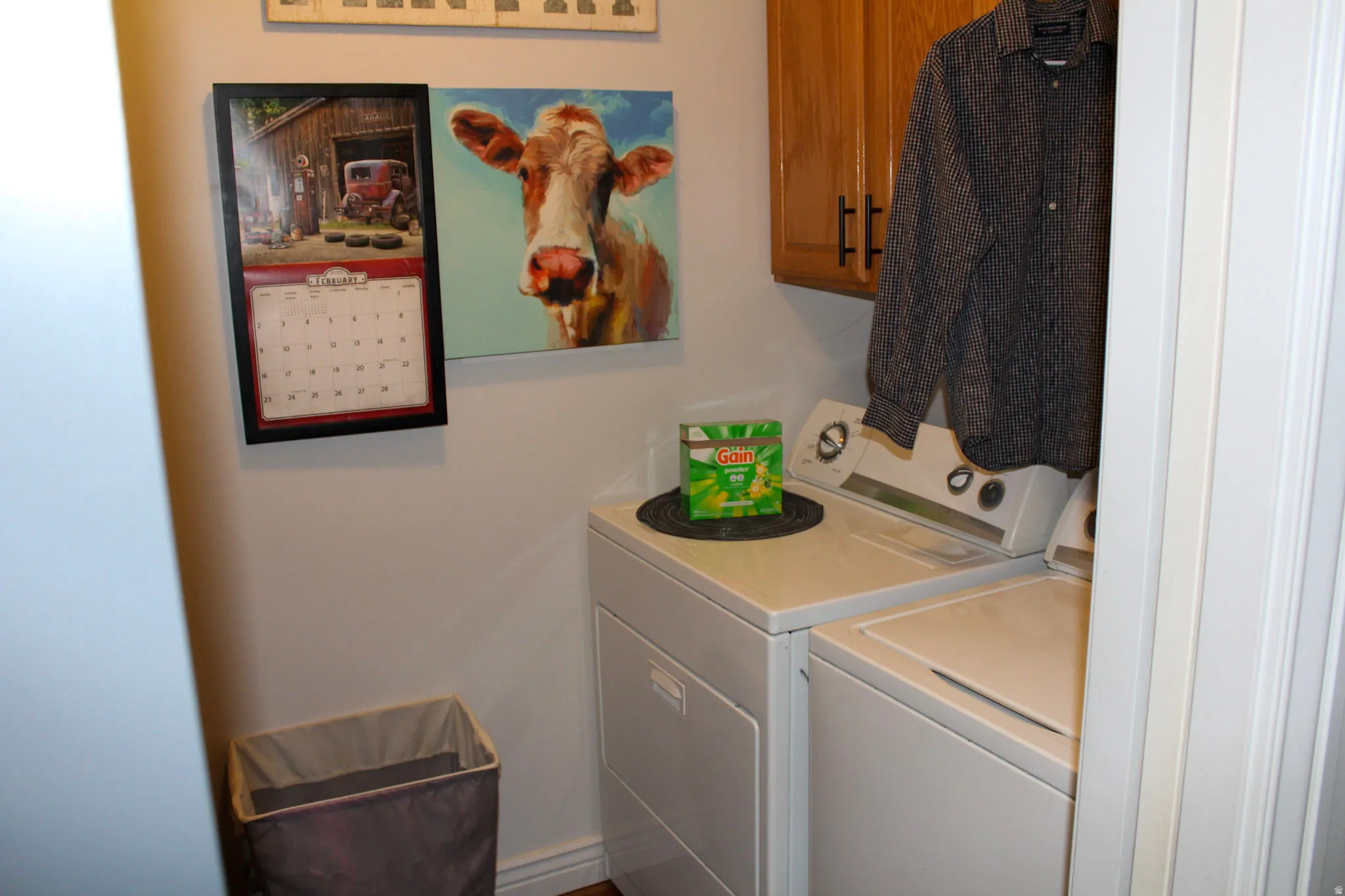 Laundry room with washing machine and clothes dryer and cabinet space