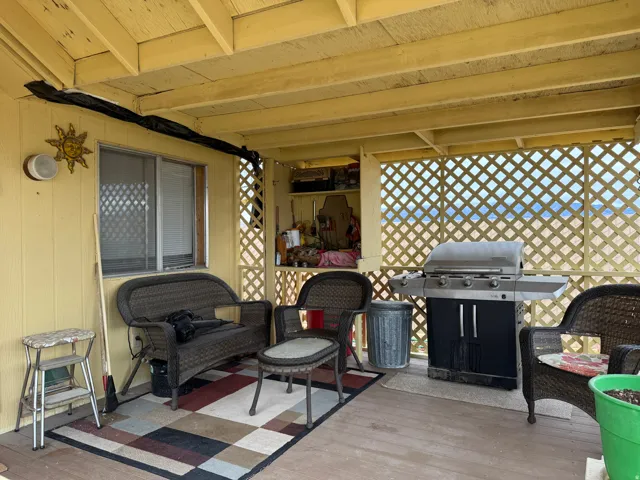 View of patio / terrace with area for grilling and a deck